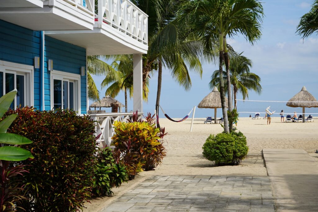 Aerial view of a beachfront villa on a Caribbean coastline