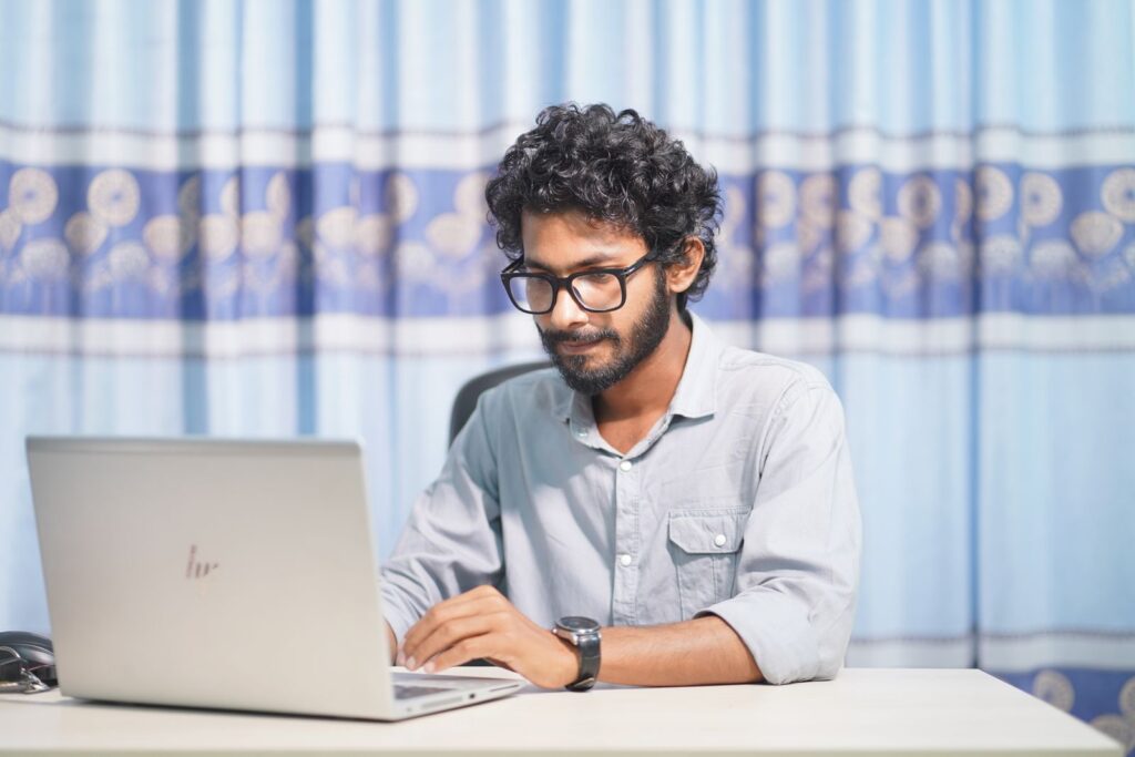 Developer working on a website at a laptop