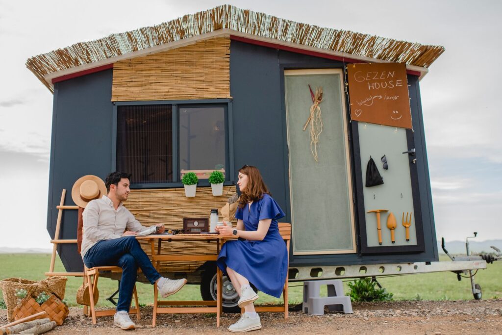 Couple outside a stylish tiny home